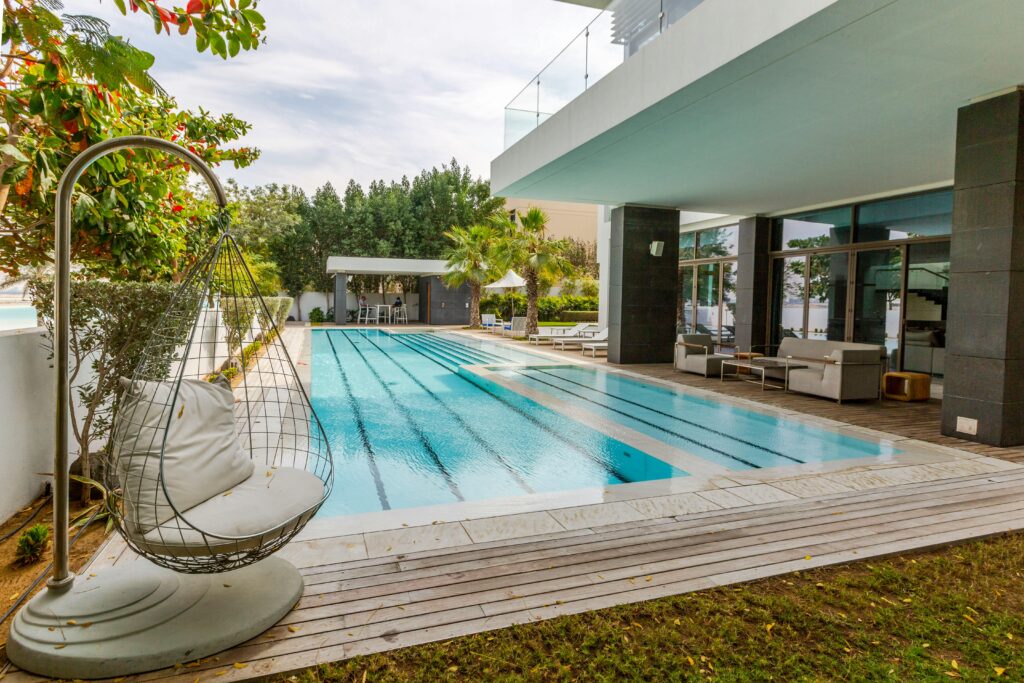 pexels-photo-10647349-10647349 Explore a modern luxury villa featuring a sleek swimming pool and spacious terrace in Dubai.